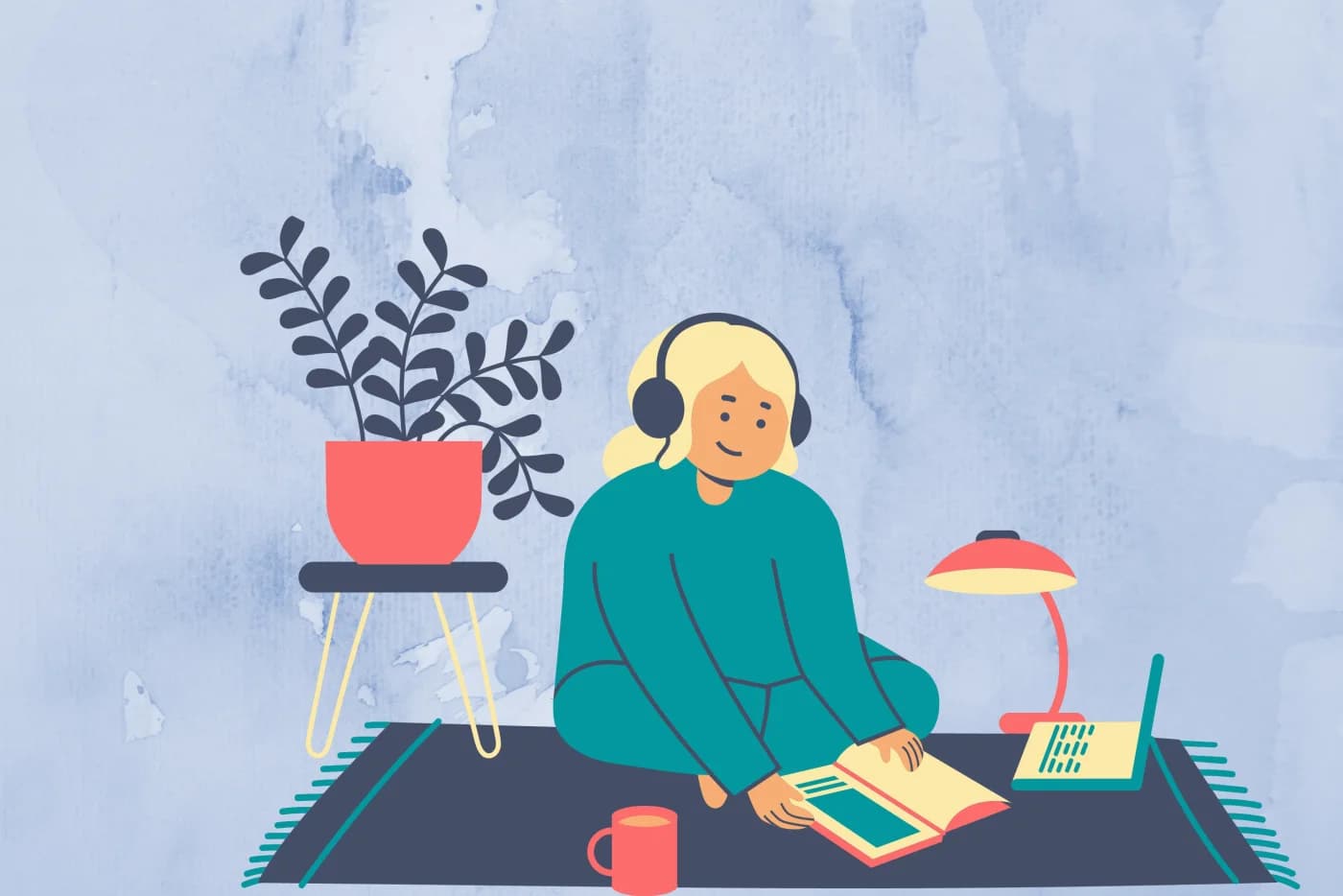 An author sitting cross-legged, wearing headphones, reading from a book aloud next to a laptop and a cup of tea